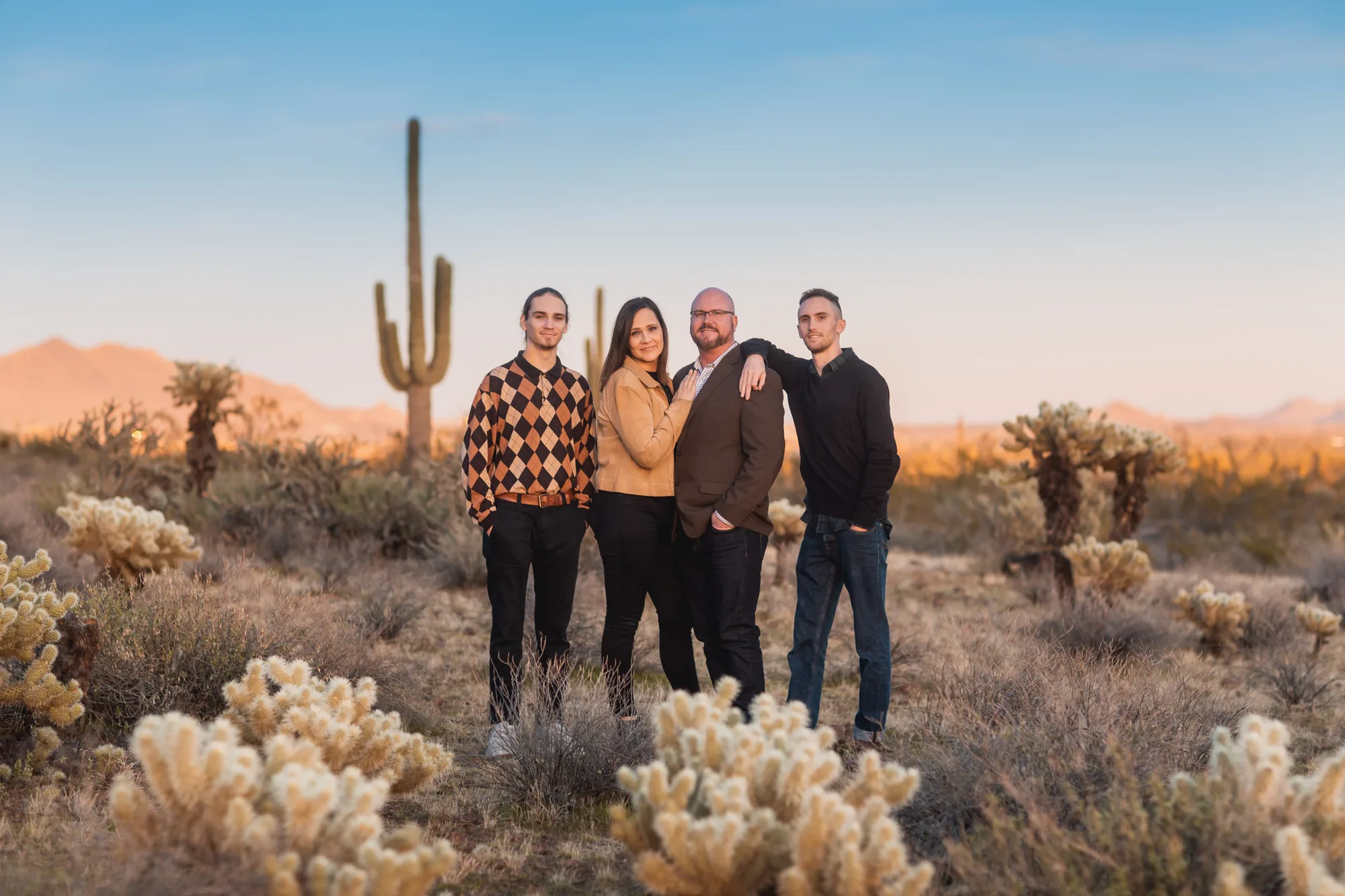 Professional family portrait session at golden hour in Wyoming